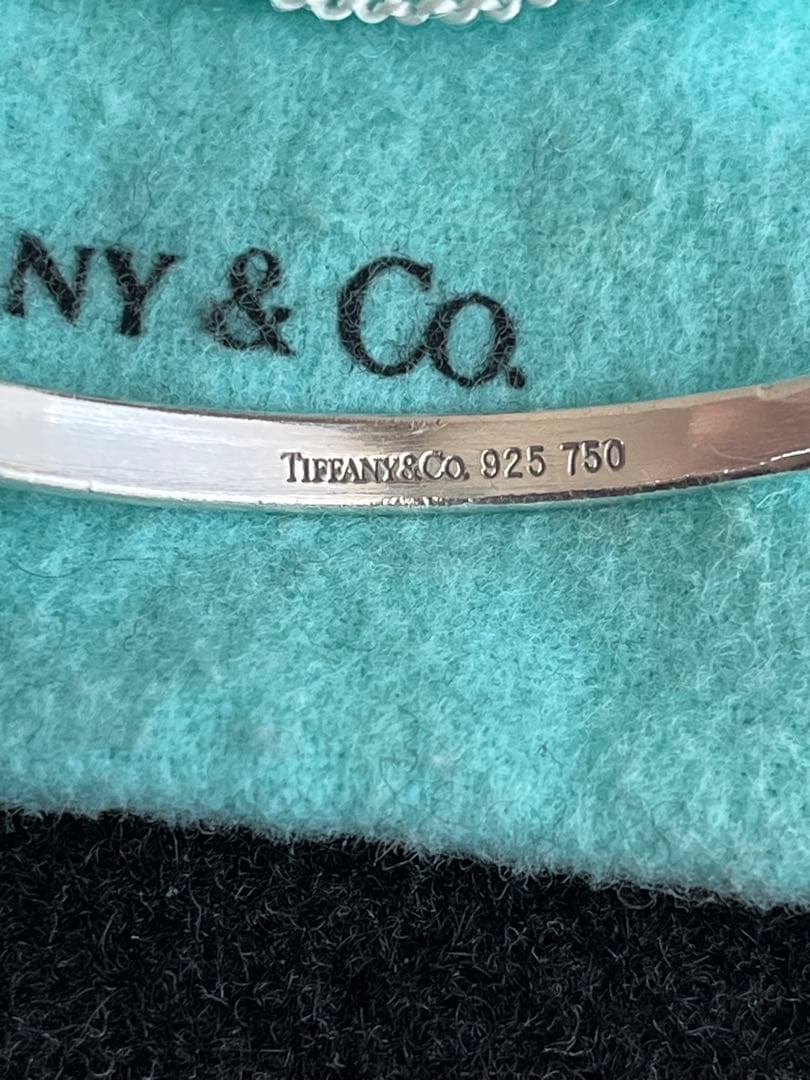 ティファニー TIFFANY フックアンドアイ バングル SV YG コンビ - メルカリ